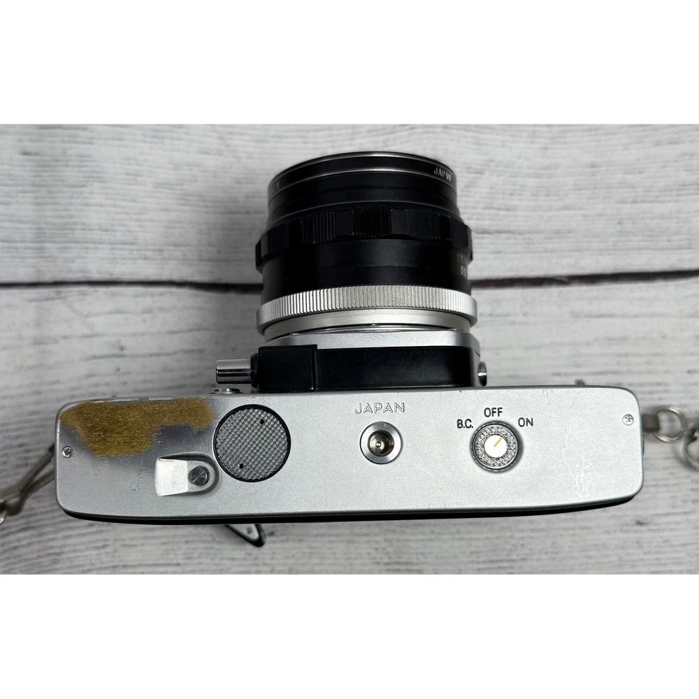 Minolta SRT‎ 101 35mm SLR Film Camera with MC Rokkor-PF 55mm f1.7 Lens Silver